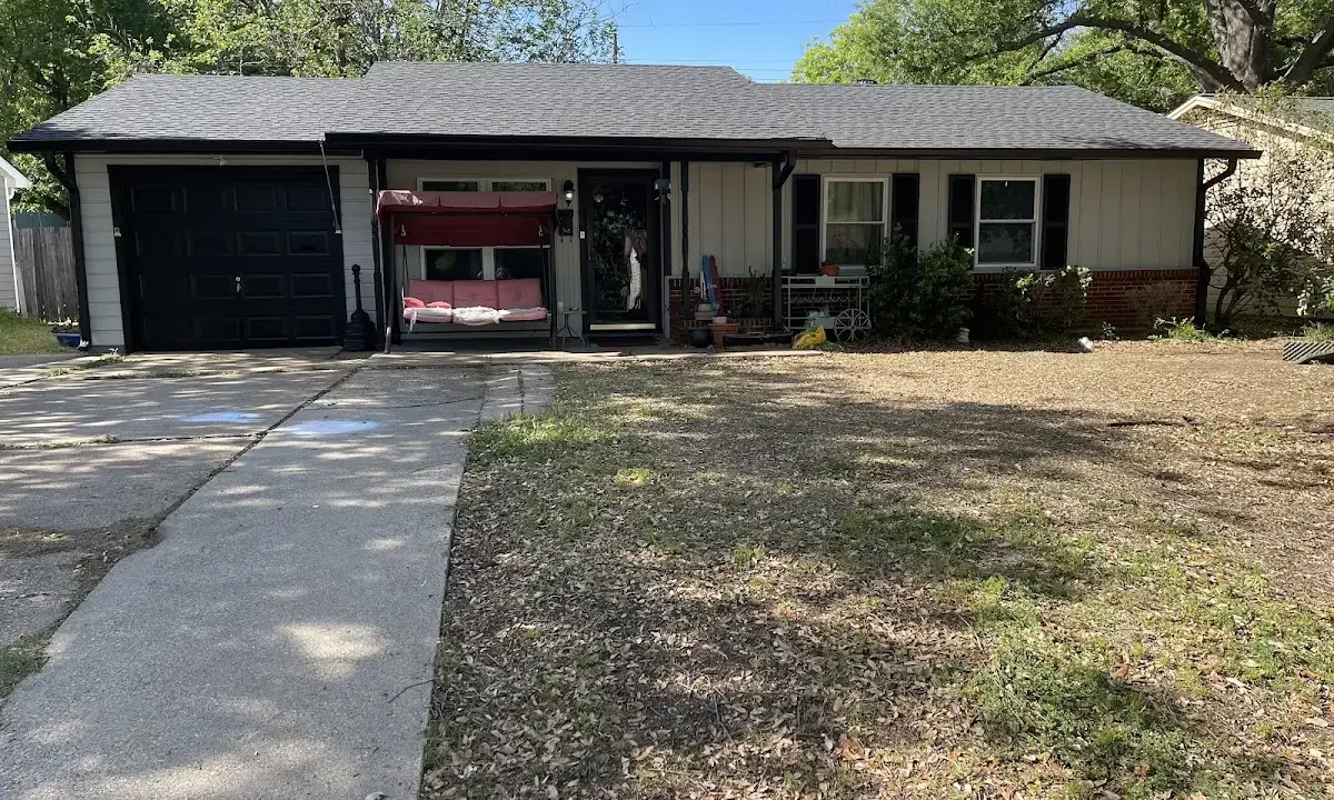Wind Damage Roof Repair crew at work on a residential roof in Texarkana